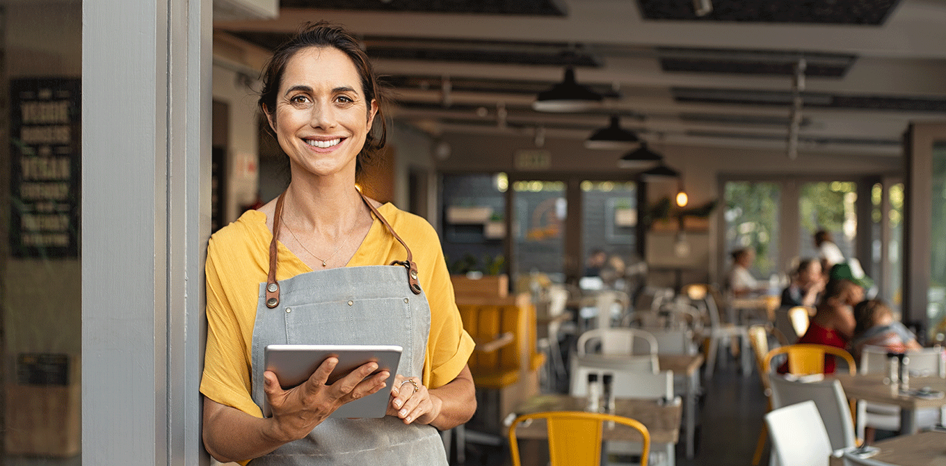 Business woman smiling with tablet